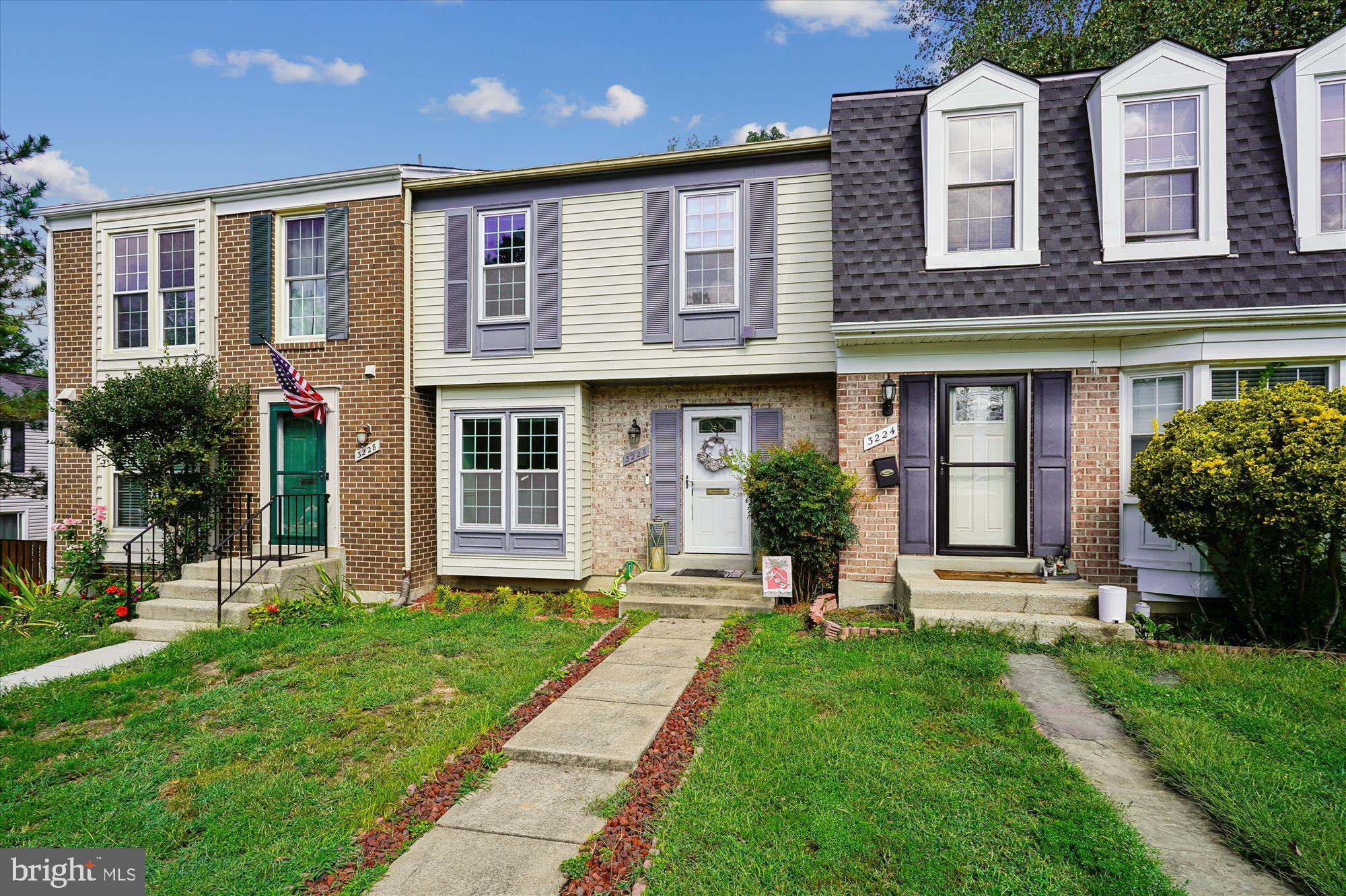 Charming townhome with inviting curb appeal.