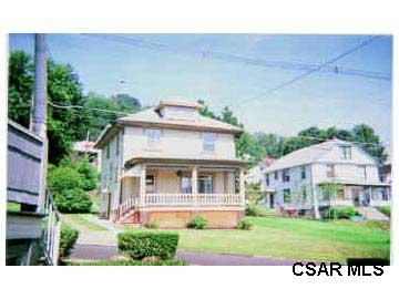 175 Sell Street Johnstown, PA 15905 - Photo 1 of 1 a view of a white house with a big yard and potted plants
