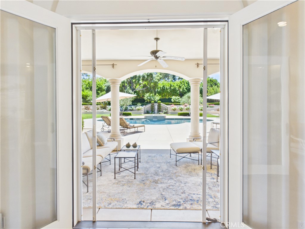 1662 Cherokee Road Corona, CA 92881 - Photo 17 of 60 a living room with a floor to ceiling window and a glass door