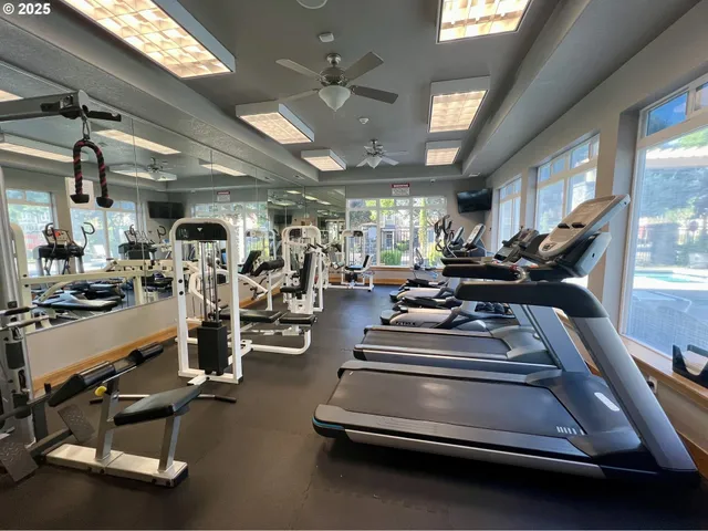 a view of swimming pool with outdoor seating and plants