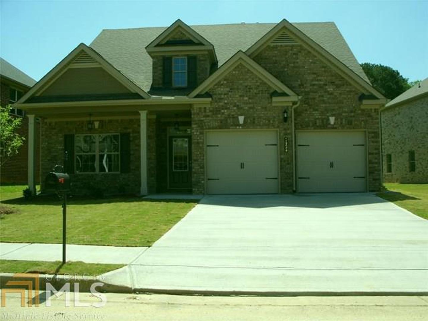 1058 Reddy Farm Lane, Unit 5 Grayson, GA 30017 - Photo 1 of 1 a front view of a house with a garden