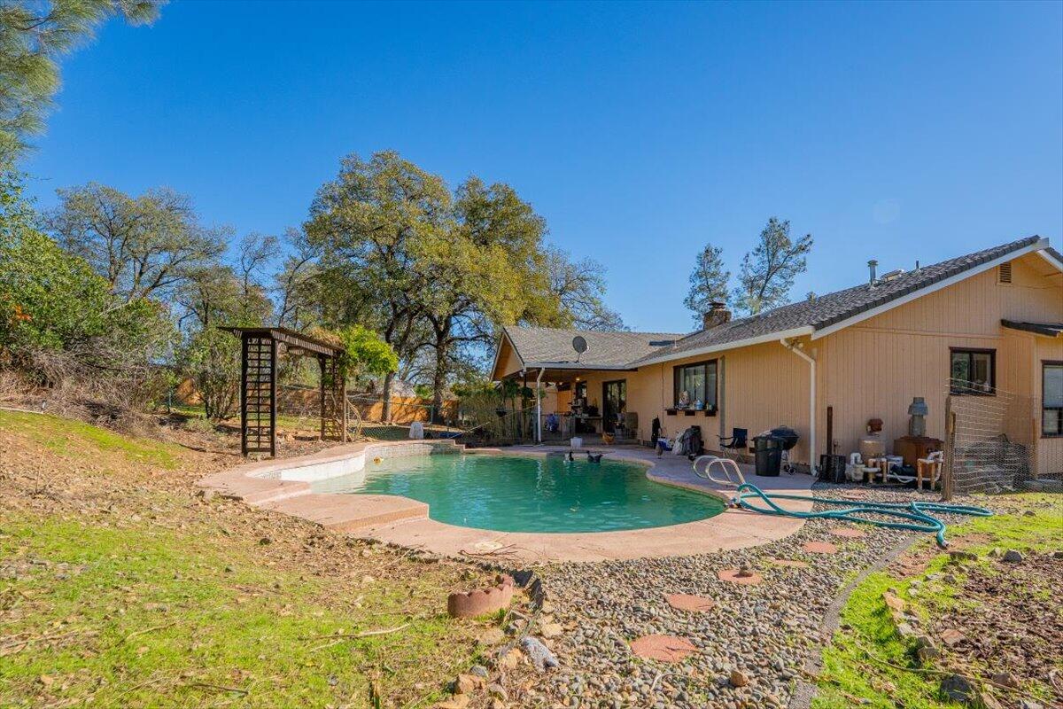 13160 Bear Mountain Road Redding, CA 96003 - Photo 11 of 40 a view of a house with a yard