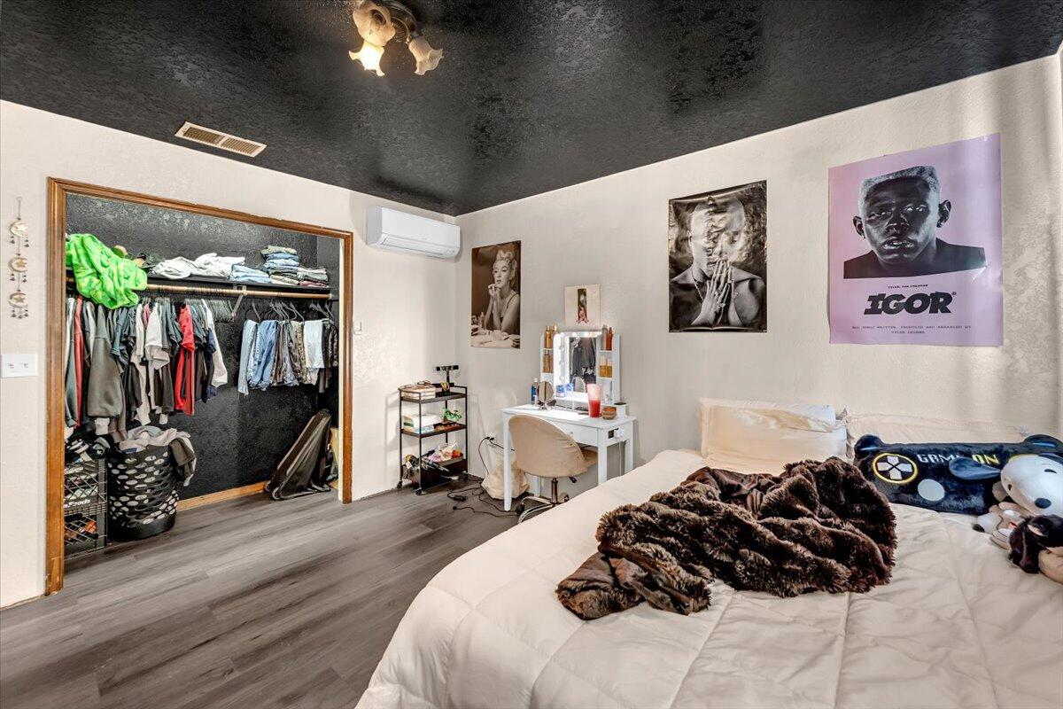 13160 Bear Mountain Road Redding, CA 96003 - Photo 15 of 40 a bedroom with furniture and a window