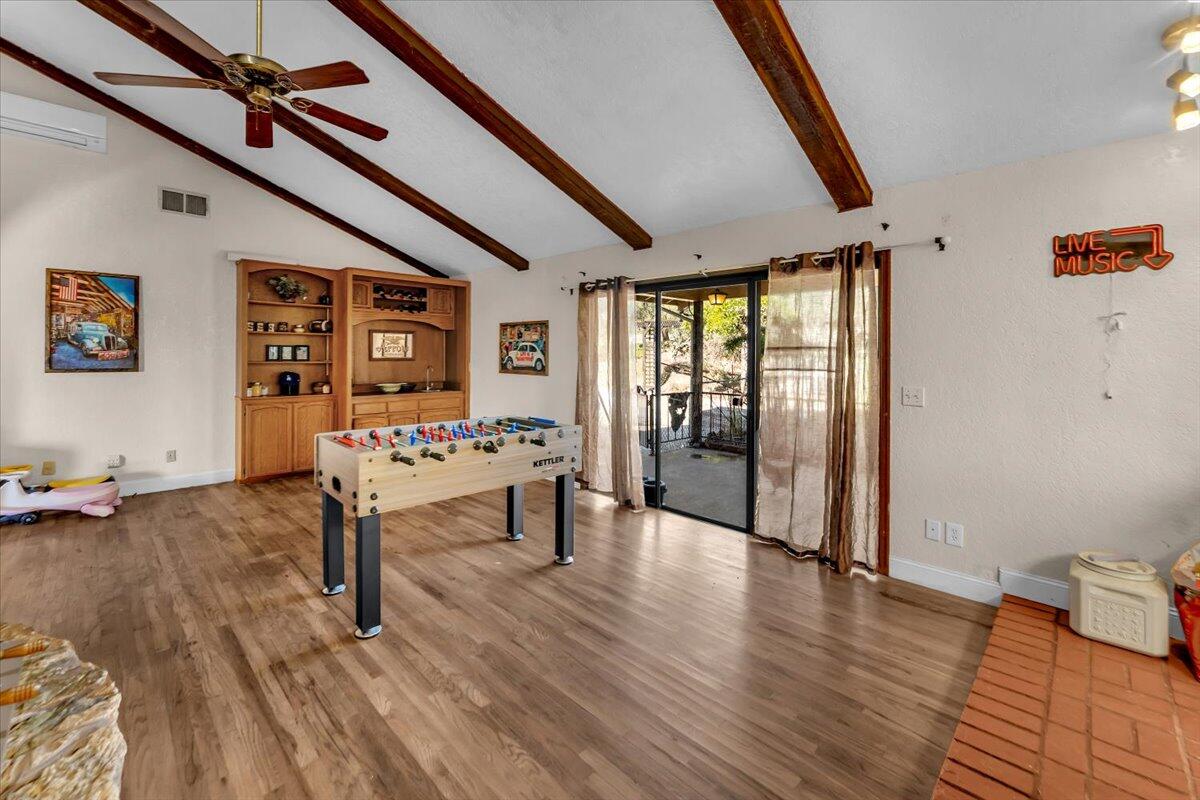 13160 Bear Mountain Road Redding, CA 96003 - Photo 34 of 40 a living room with furniture and a wooden floor