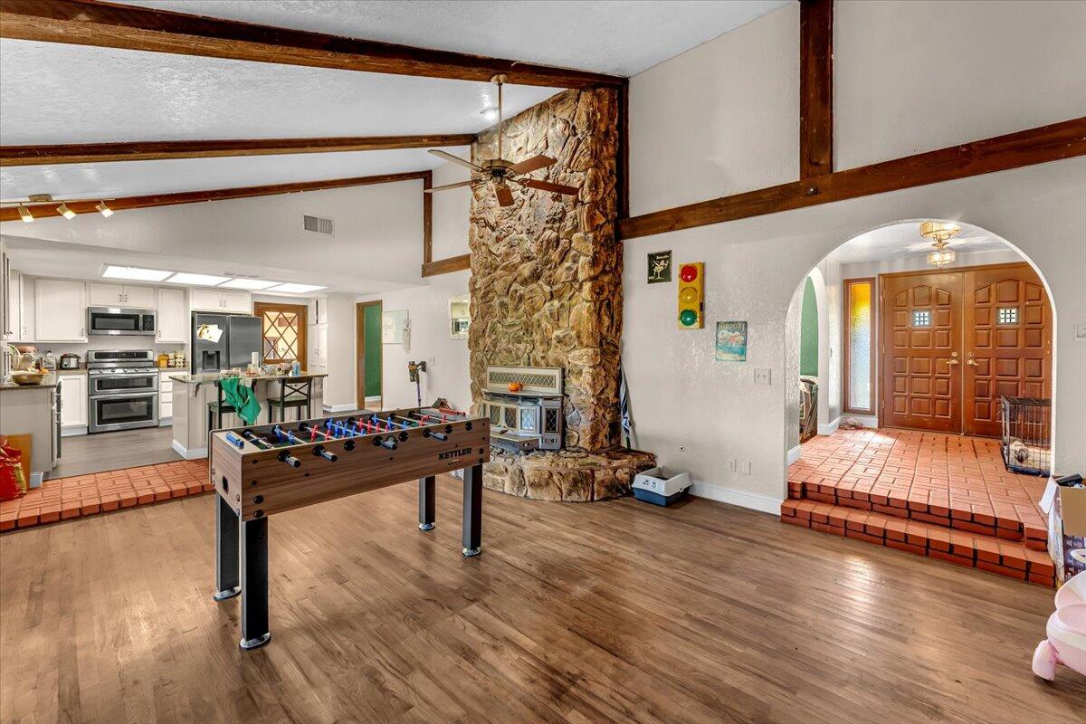 13160 Bear Mountain Road Redding, CA 96003 - Photo 36 of 40 a living room with furniture and wooden floor