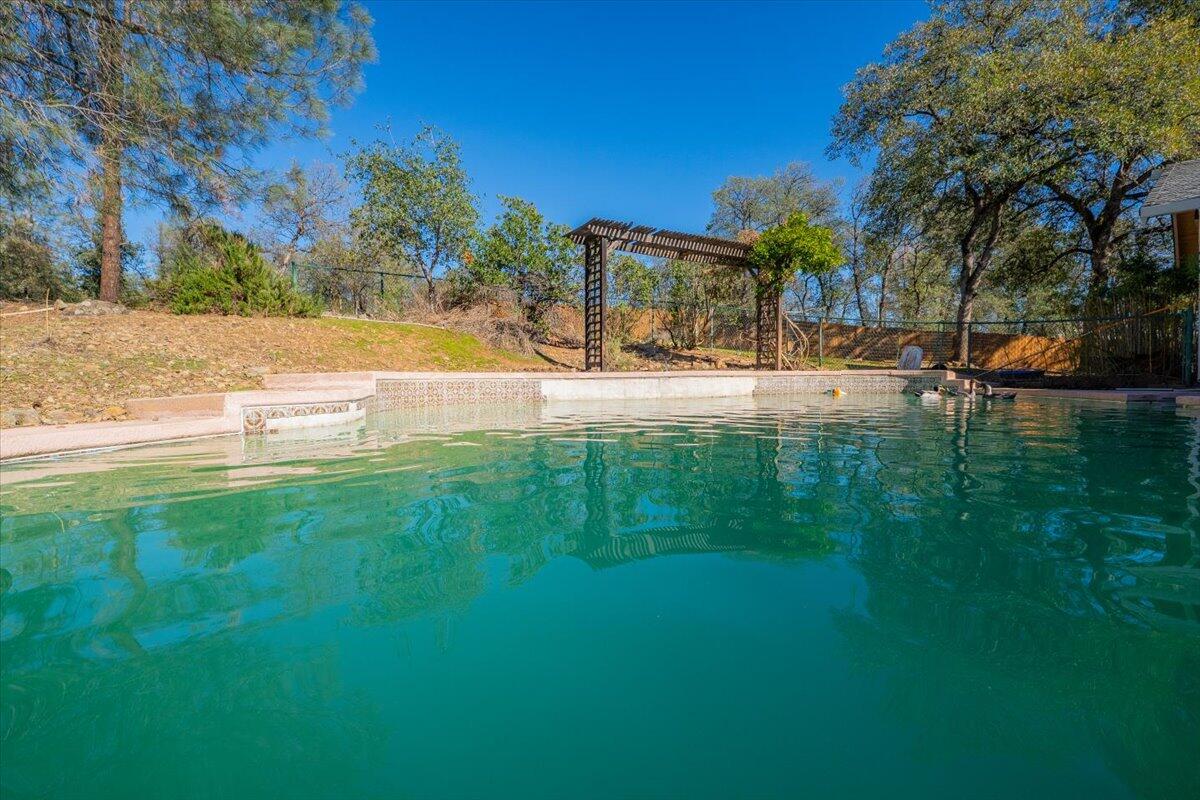 13160 Bear Mountain Road Redding, CA 96003 - Photo 8 of 40 a view of yard with swimming pool and green space