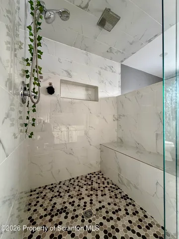 a utility room with a couch and dryer