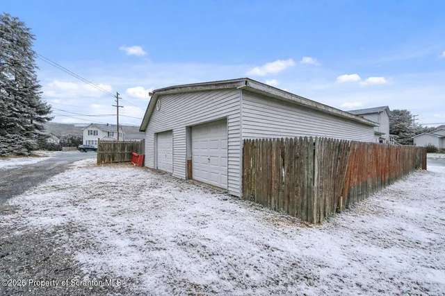 a kitchen with stainless steel appliances a stove a sink and a refrigerator