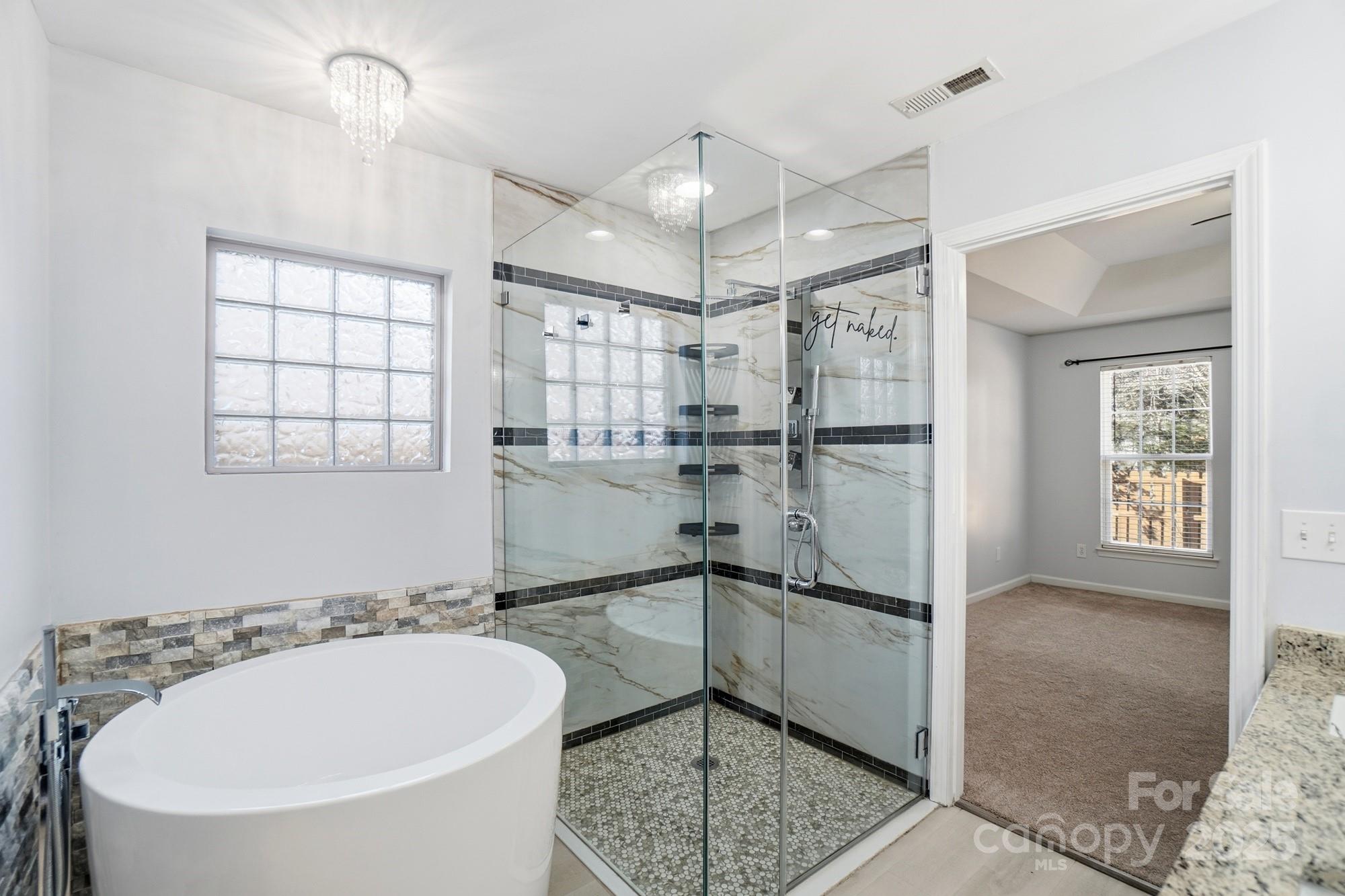 630 Springhouse Place Clover, SC 29710 - Photo 18 of 32 a bathroom with a sink a bathtub and shower
