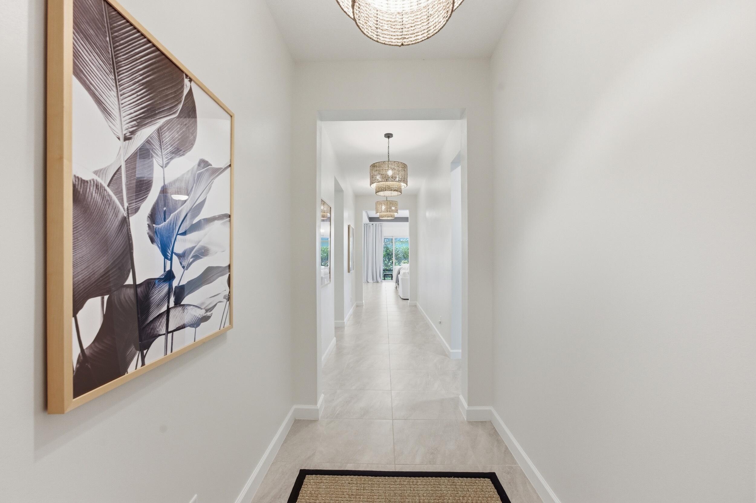 19230 Rolling Acres Road Loxahatchee, FL 33470 - Photo 14 of 58 a view of a hallway with wooden floor and closet