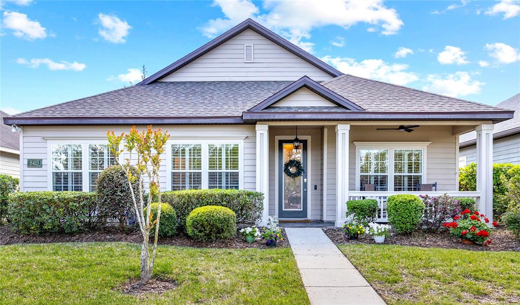8415 Southwest 78th Lane Gainesville, FL 32608 - Photo 1 of 1 a front view of a house with a garden and plants