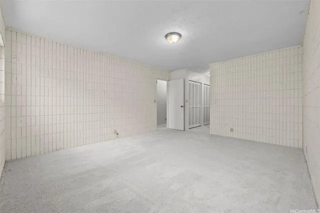a bathroom with a granite countertop sink a toilet and a mirror