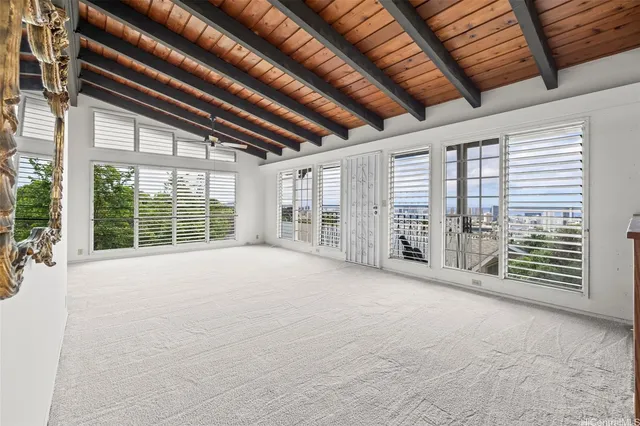 a view of an empty room with windows