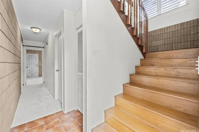 a view of entryway with wooden floor and stairs