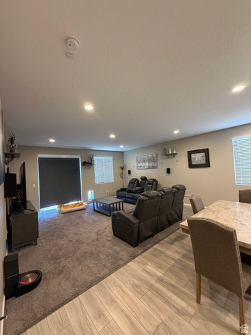 118 Tram Rock Rd. Lake Point, UT 84074 - Photo 8 of 34 Spacious living area featuring recessed lighting, a large sliding glass door