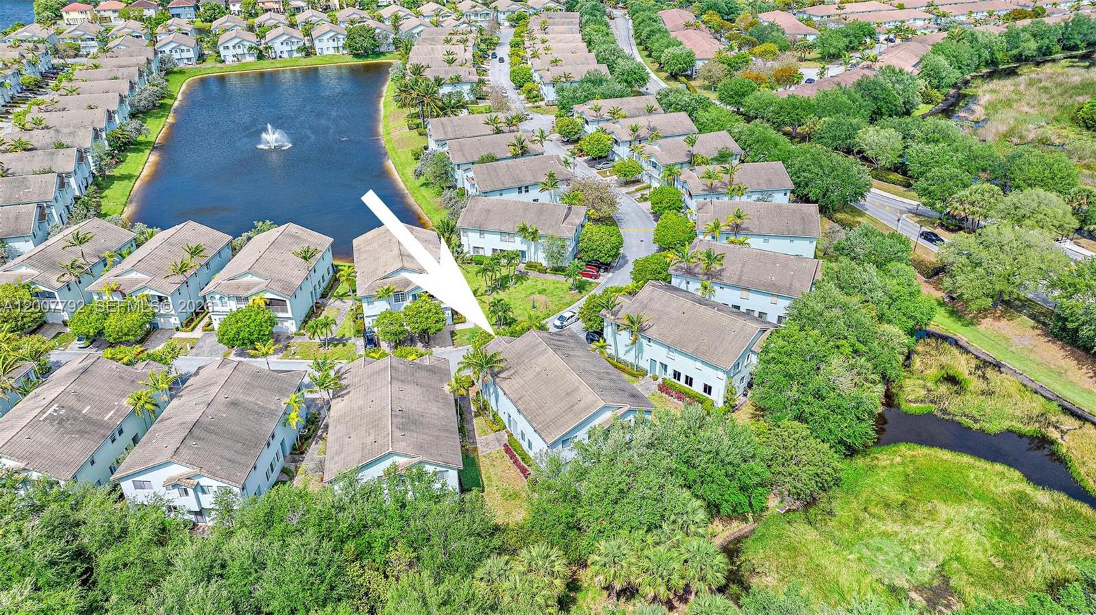 3229 Laurel Ridge Circle, Unit 3229 Riviera Beach, FL 33404 - Photo 23 of 24 an aerial view of a house with a yard and garden view