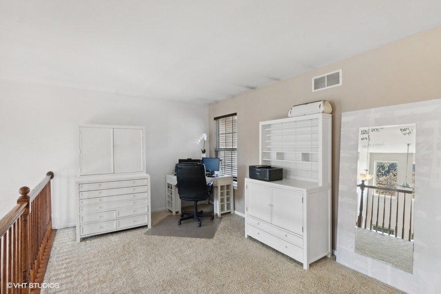 990 Oak Ridge Boulevard Elgin, IL 60120 - Photo 14 of 19 a view of a livingroom with furniture and windows