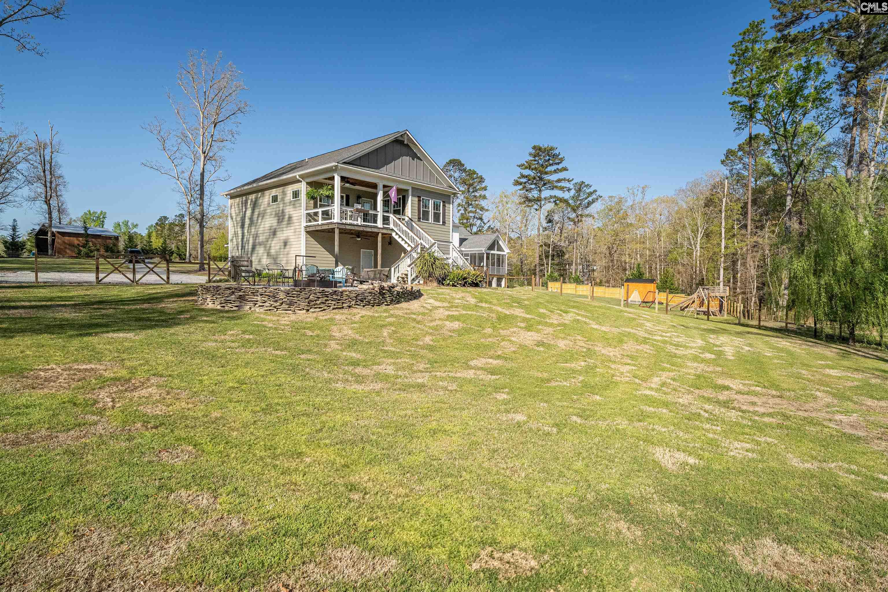 649 Sandbar Road Chapin, SC 29036 - Photo 29 of 40 a view of a house with a yard