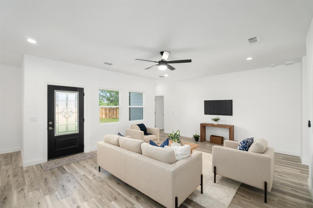 228 Windjammer Road Gun Barrel City, TX 75156 - Photo 6 of 19 a living room with furniture and a flat screen tv