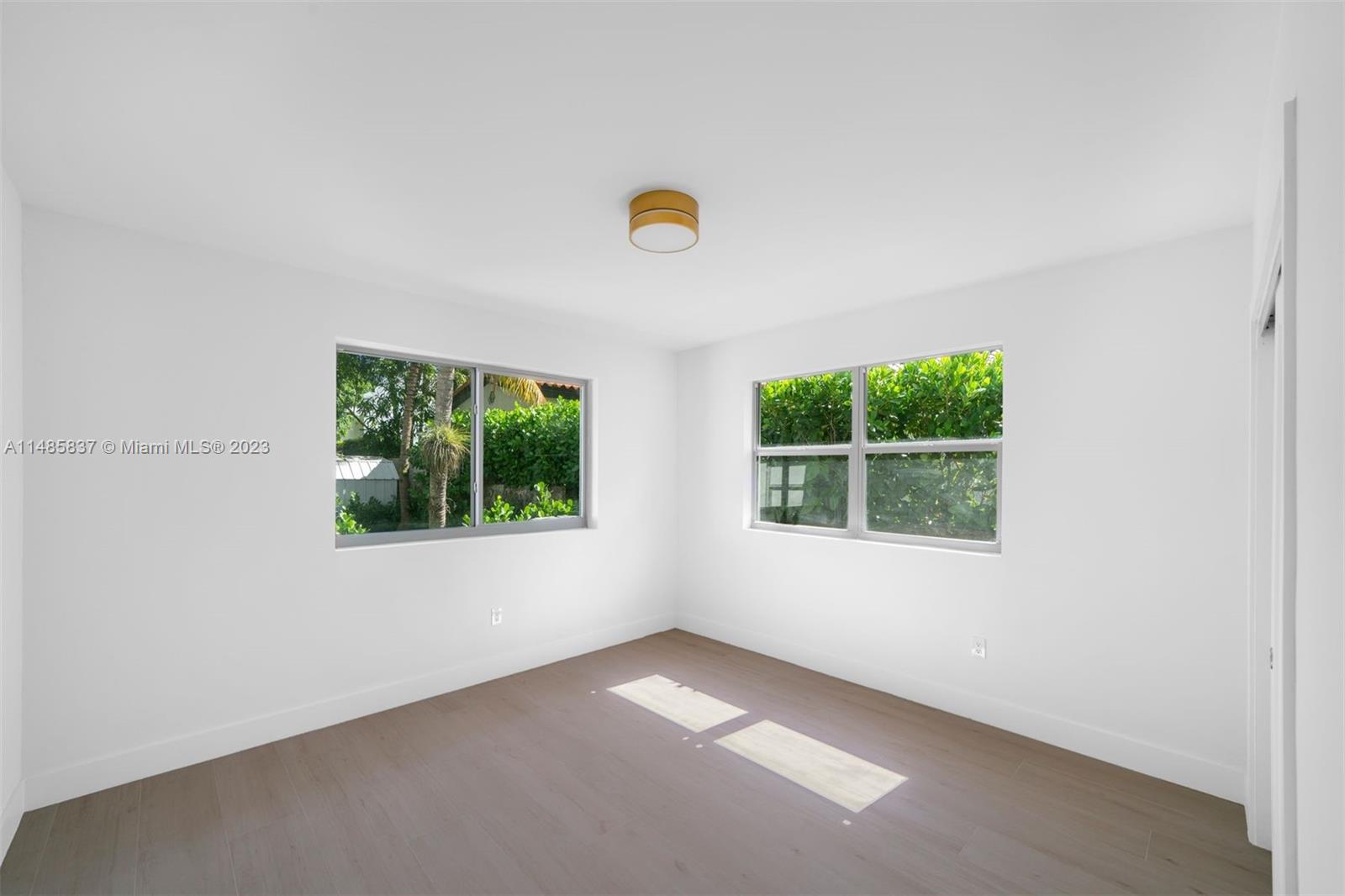 2385 North Bay Road Miami Beach, FL 33140 - Photo 19 of 35 an empty room with a window
