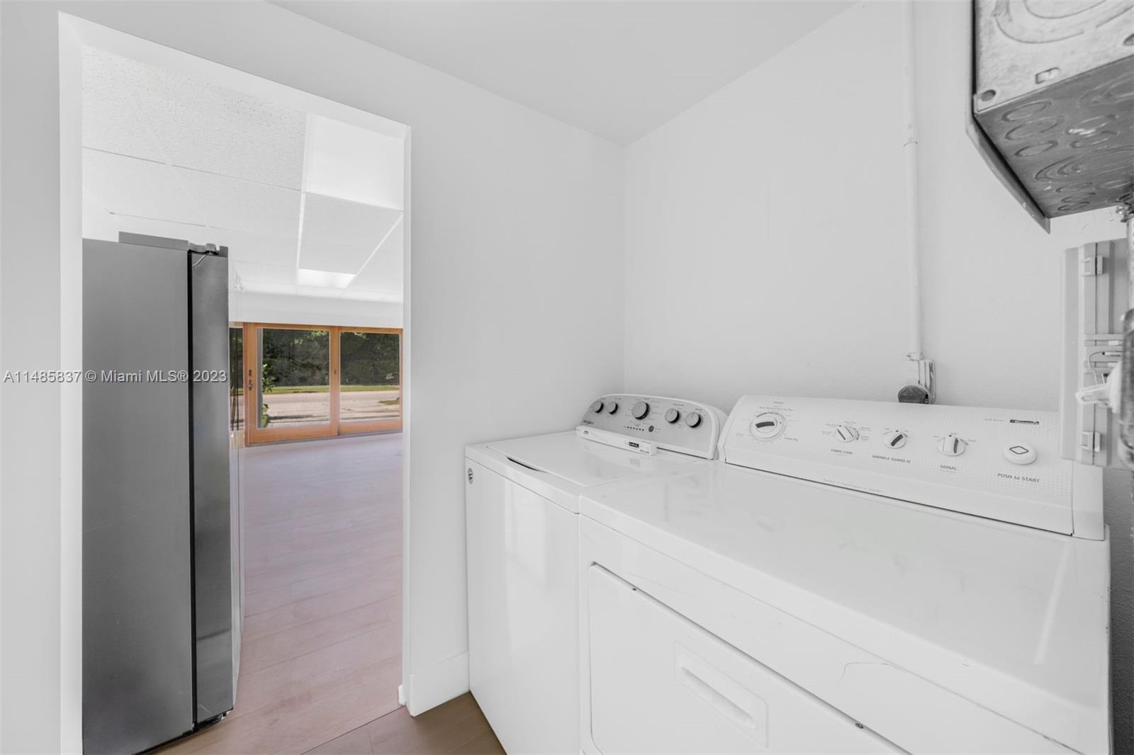 2385 North Bay Road Miami Beach, FL 33140 - Photo 23 of 35 a utility room with dryer and washer