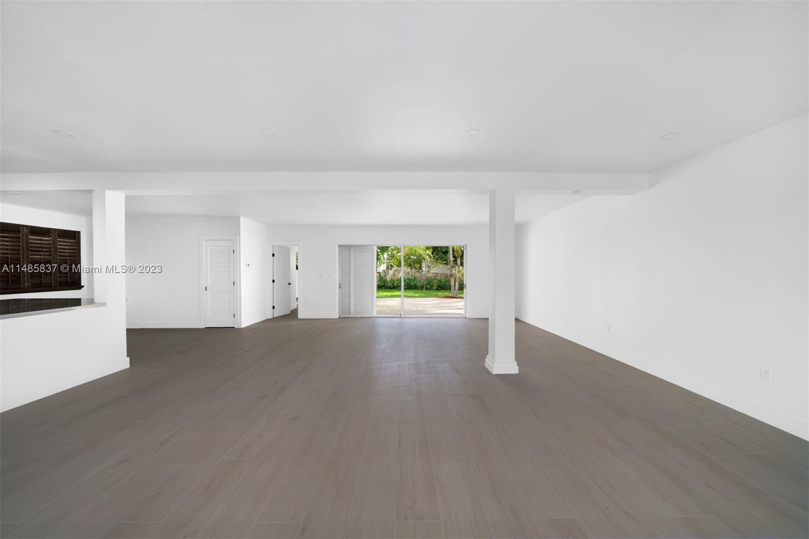 2385 North Bay Road Miami Beach, FL 33140 - Photo 4 of 35 a view of an empty room with a window