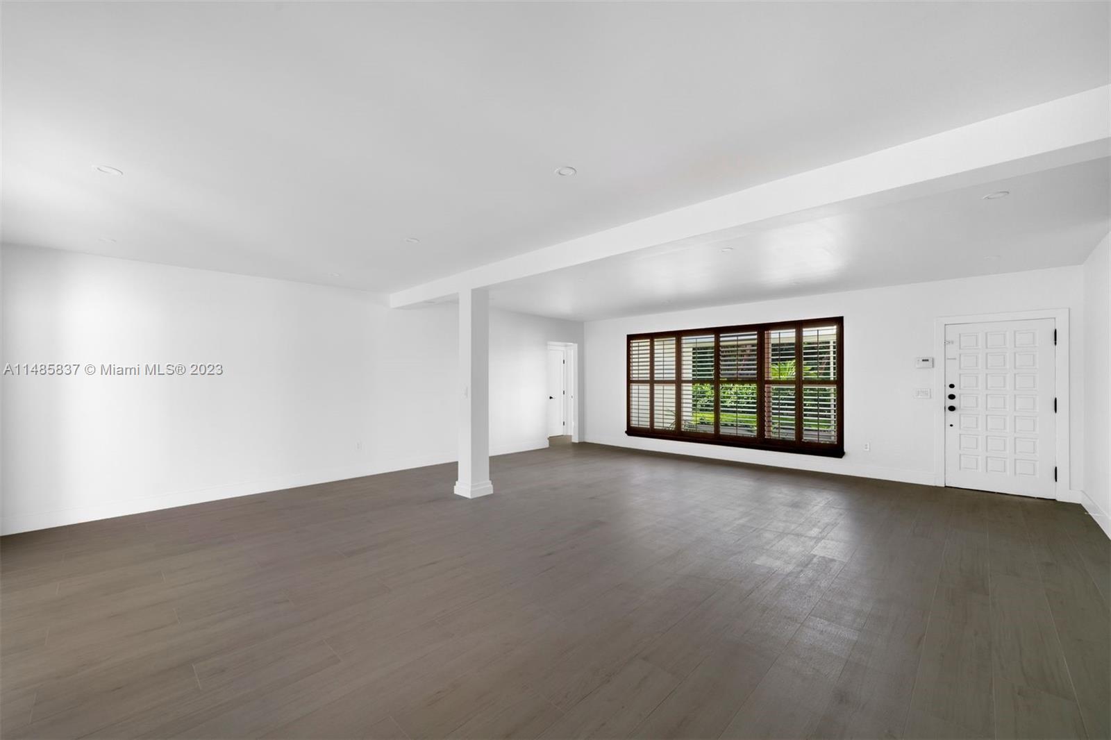 2385 North Bay Road Miami Beach, FL 33140 - Photo 7 of 35 an empty room with windows and closet