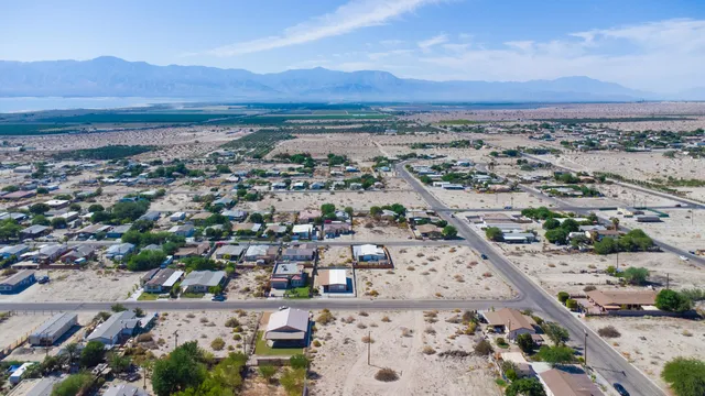 an aerial view of residential house and outdoor space