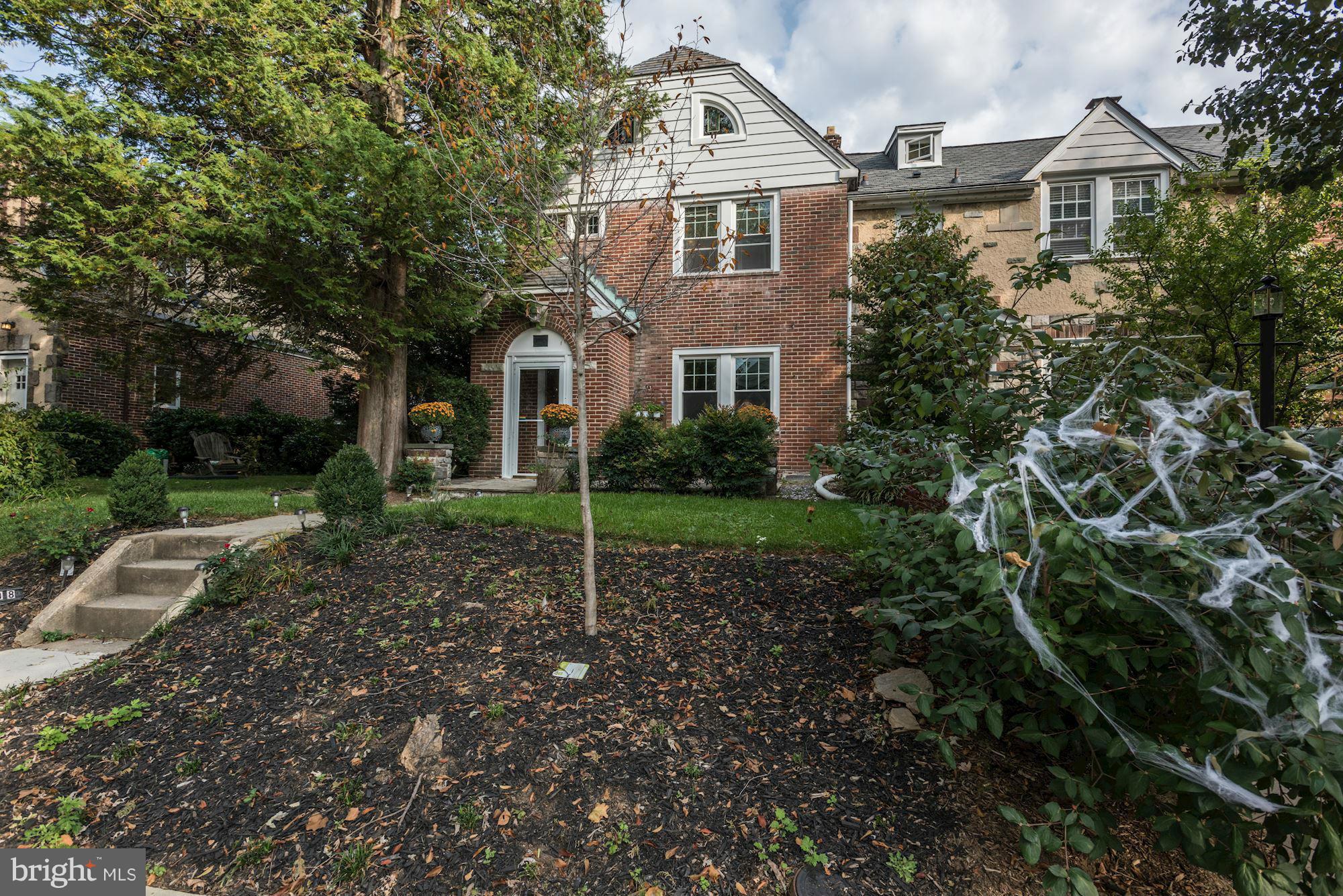 408 Hopkins Road Baltimore, MD 21212 - Photo 1 of 27 a front view of a house with garden