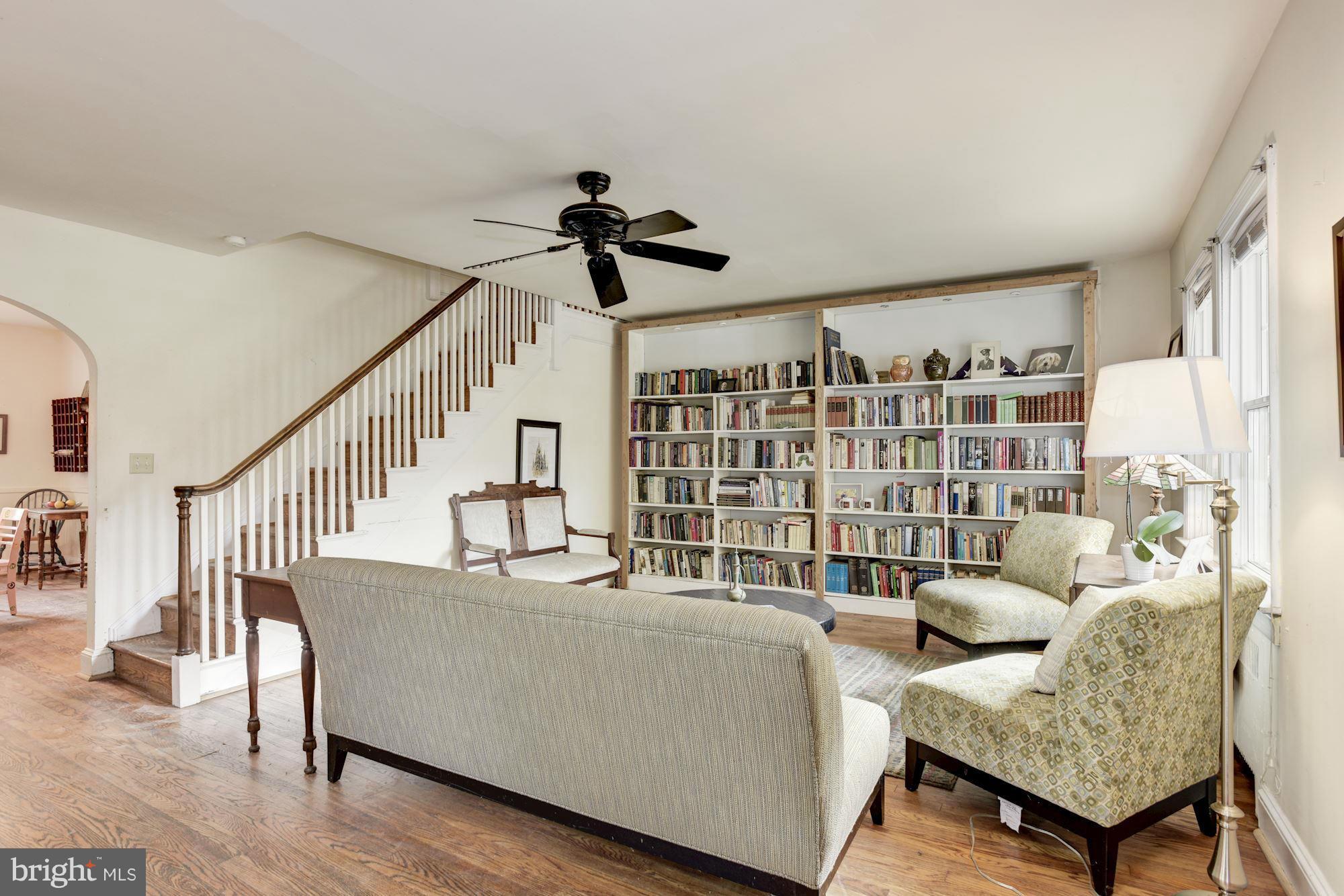 408 Hopkins Road Baltimore, MD 21212 - Photo 4 of 27 a living room with furniture and a book shelf