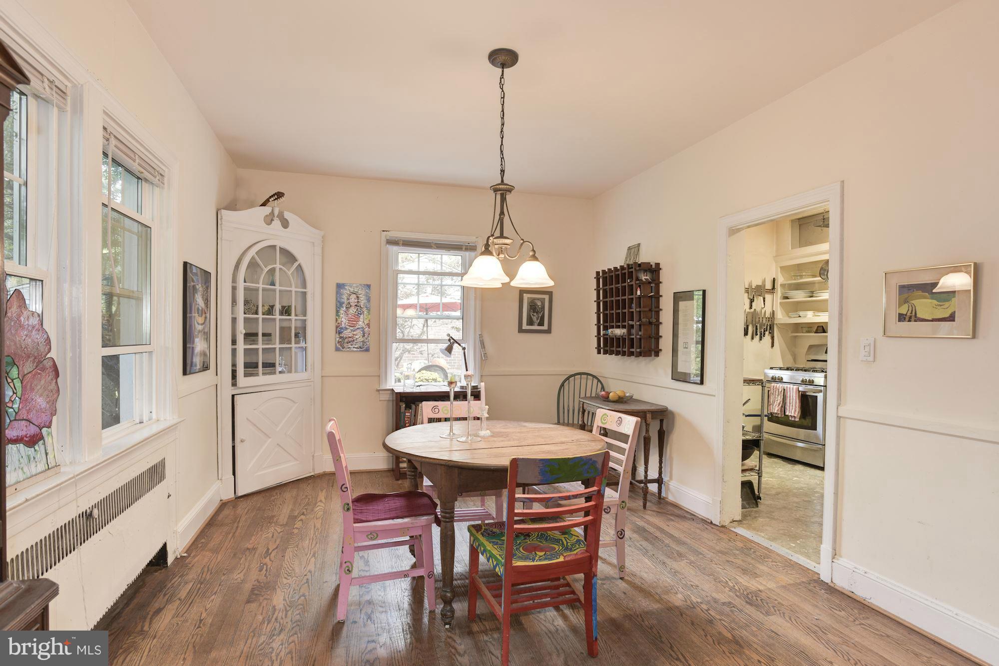 408 Hopkins Road Baltimore, MD 21212 - Photo 7 of 27 a view of a dining room with furniture window and wooden floor