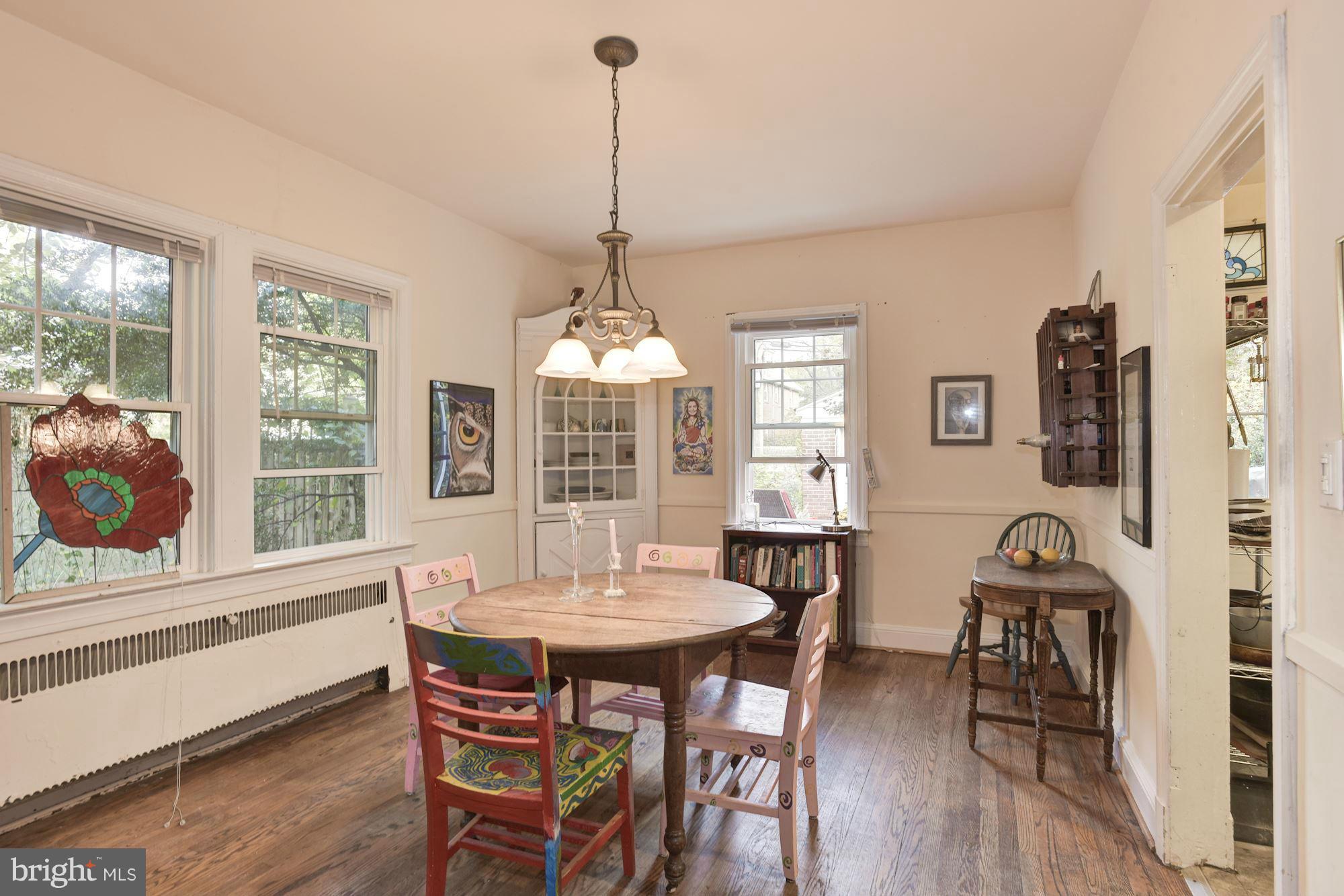 408 Hopkins Road Baltimore, MD 21212 - Photo 8 of 27 a view of a dining room with furniture window and wooden floor