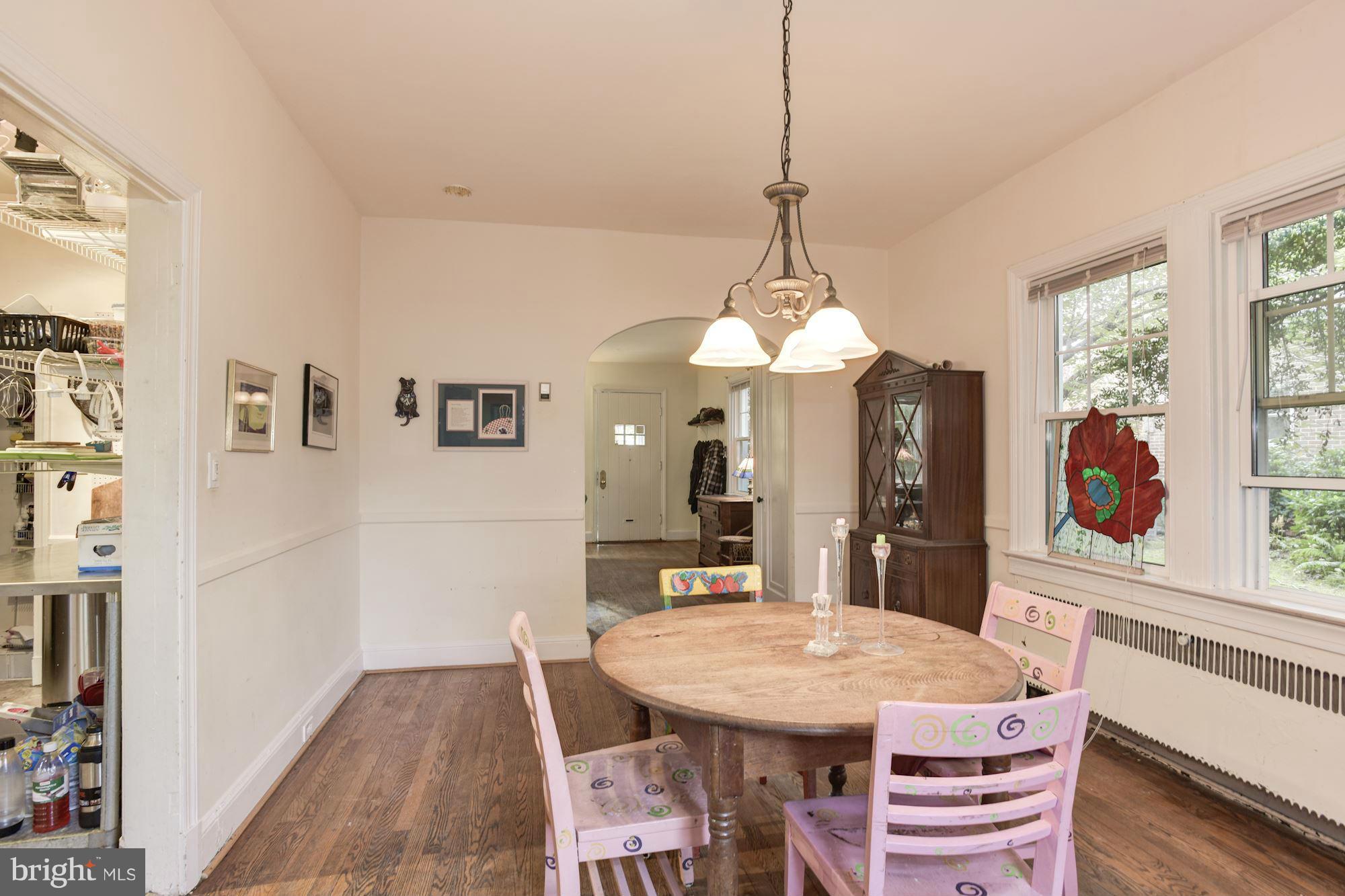 408 Hopkins Road Baltimore, MD 21212 - Photo 9 of 27 a dining room with a table or chairs and a table