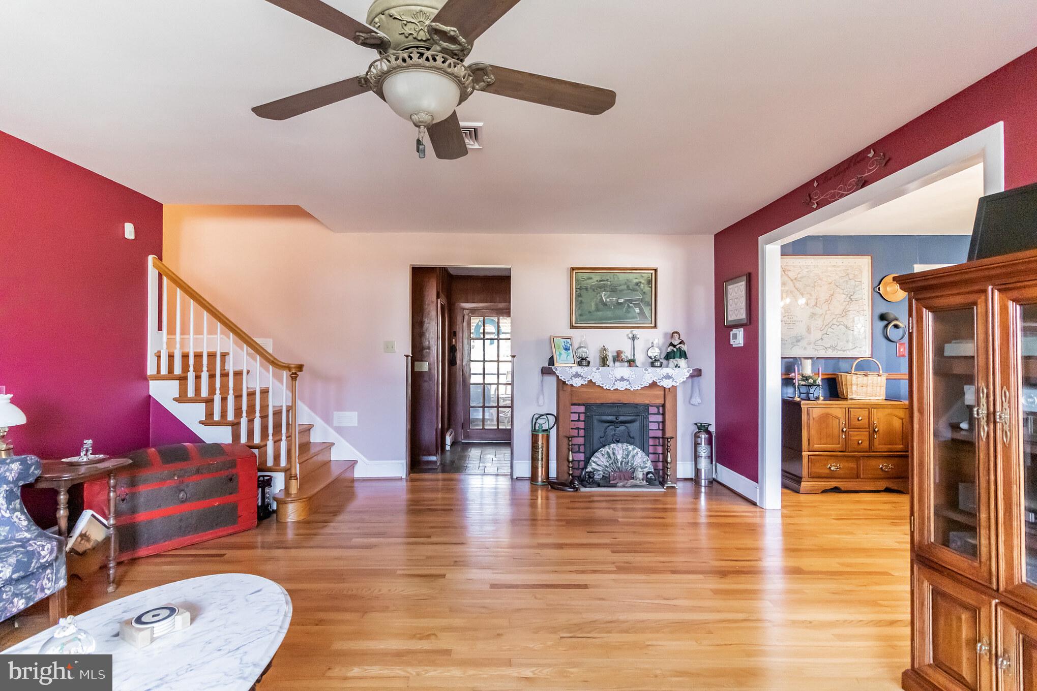 2441 Appleton Road Elkton, MD 21921 - Photo 3 of 32 a view of a livingroom with furniture hardwood floor and a ceiling fan