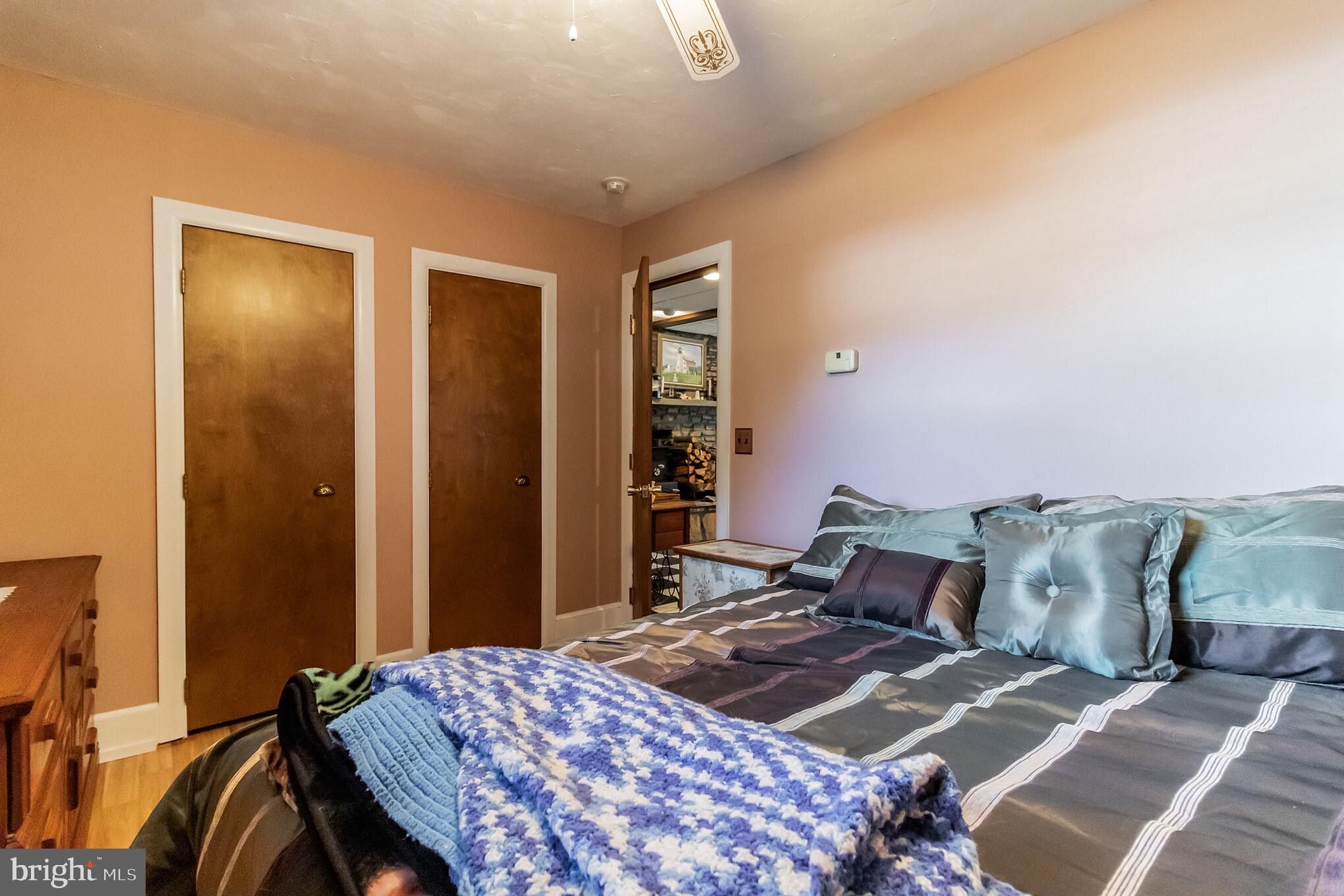 2441 Appleton Road Elkton, MD 21921 - Photo 24 of 32 a bedroom with a bed and wooden floor