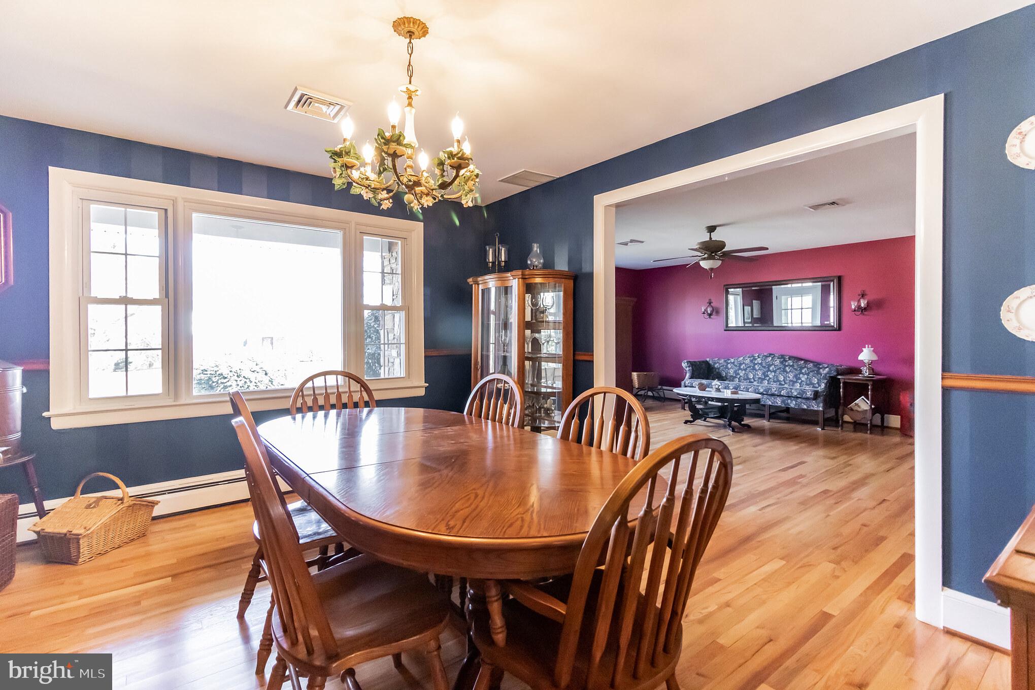 2441 Appleton Road Elkton, MD 21921 - Photo 5 of 32 a dining room with furniture a chandelier and window
