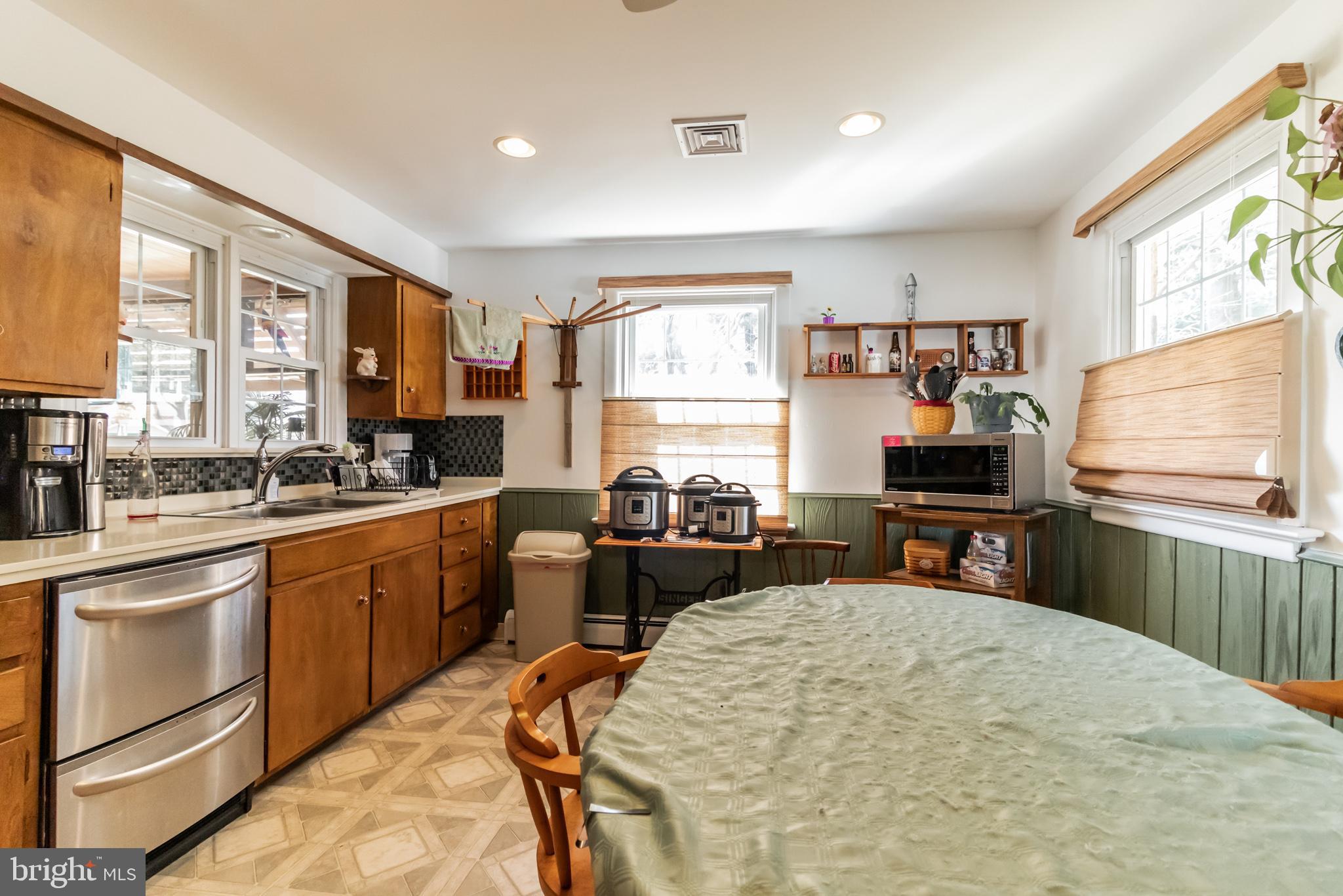 2441 Appleton Road Elkton, MD 21921 - Photo 8 of 32 a kitchen with sink refrigerator and large window