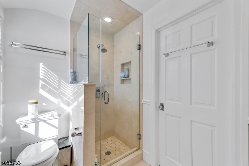 9 Hawthorne Road Short Hills, NJ 07078 - Photo 13 of 25 a bathroom with a shower and toilet