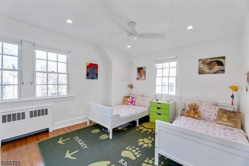 9 Hawthorne Road Short Hills, NJ 07078 - Photo 15 of 25 a bedroom with a bed and a window