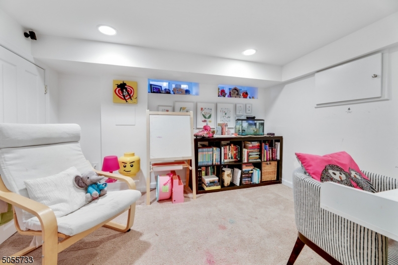 9 Hawthorne Road Short Hills, NJ 07078 - Photo 20 of 25 a living room with lots of baby furniture