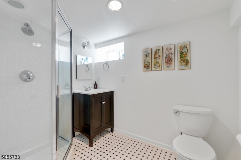 9 Hawthorne Road Short Hills, NJ 07078 - Photo 21 of 25 a bathroom with a sink a toilet and shower