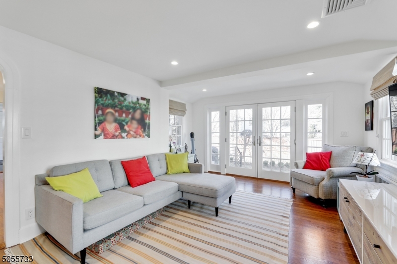 9 Hawthorne Road Short Hills, NJ 07078 - Photo 8 of 25 a living room with furniture and a large window with wooden floor