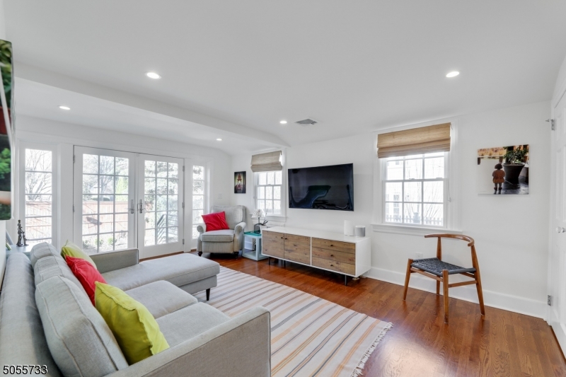 9 Hawthorne Road Short Hills, NJ 07078 - Photo 9 of 25 a living room with furniture and a flat screen tv