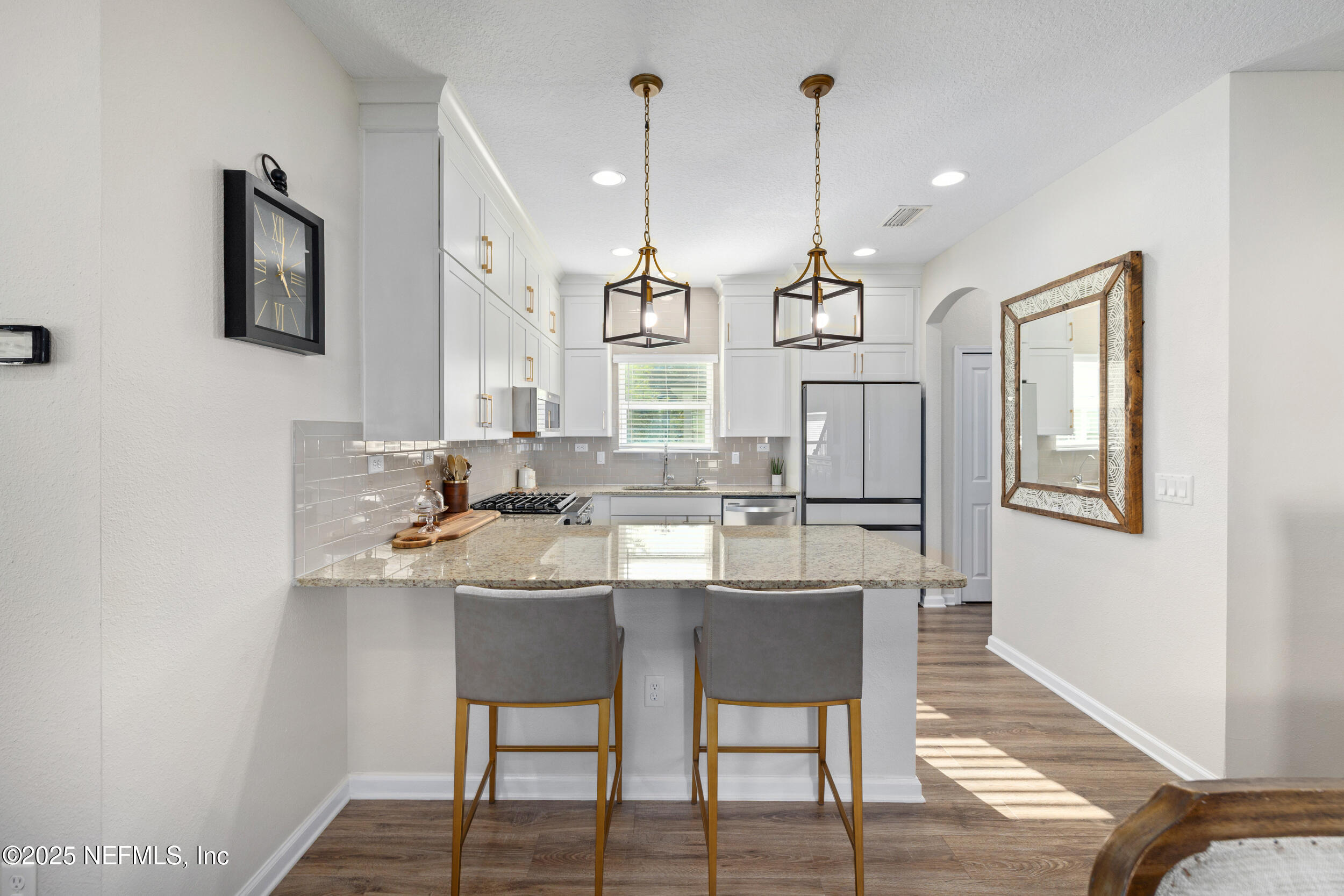 111 Beam Lane St. Augustine, FL 32095 - Photo 11 of 46 a kitchen with stainless steel appliances kitchen island granite countertop a sink and cabinets