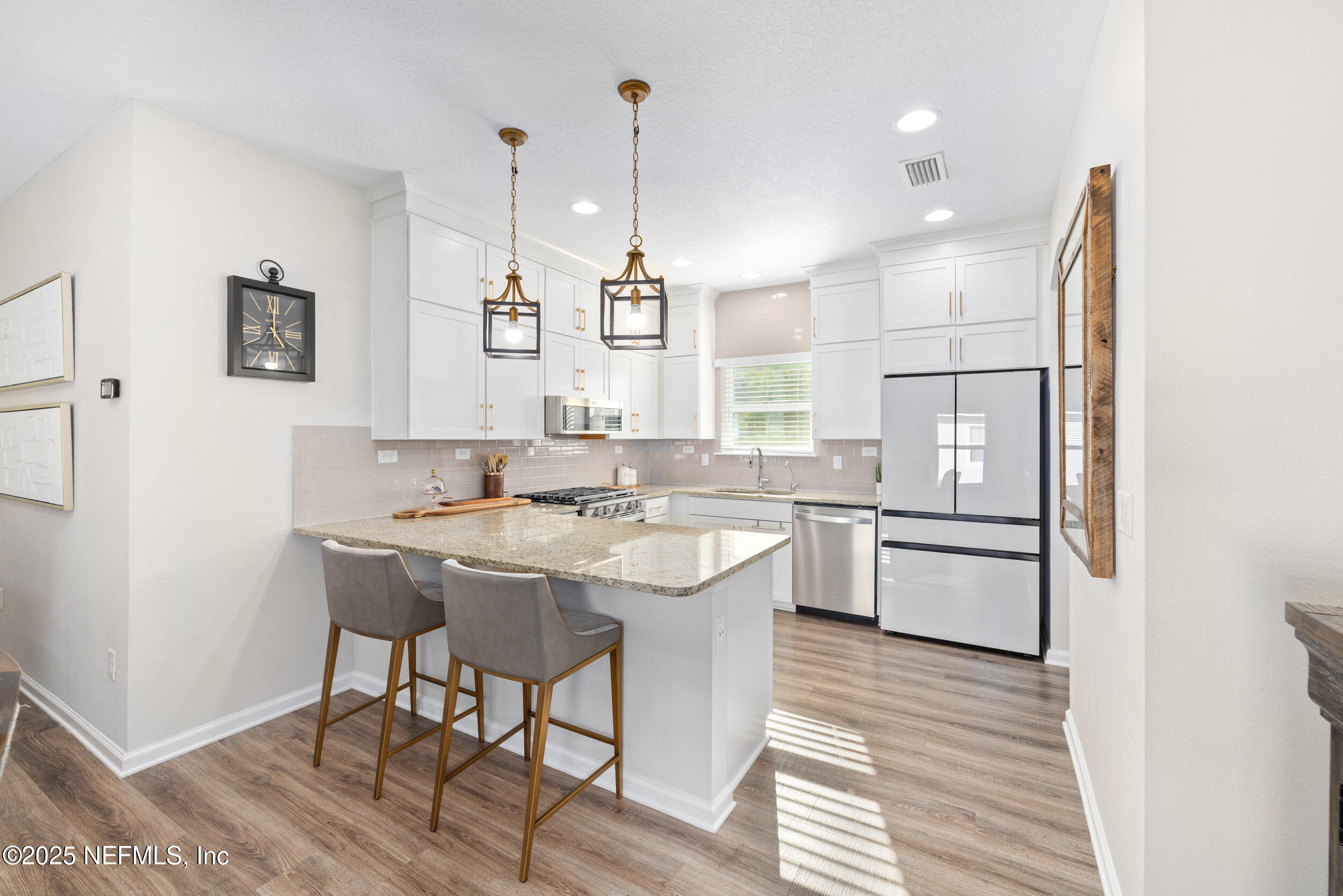 111 Beam Lane St. Augustine, FL 32095 - Photo 12 of 46 a kitchen with a sink cabinets and wooden floor