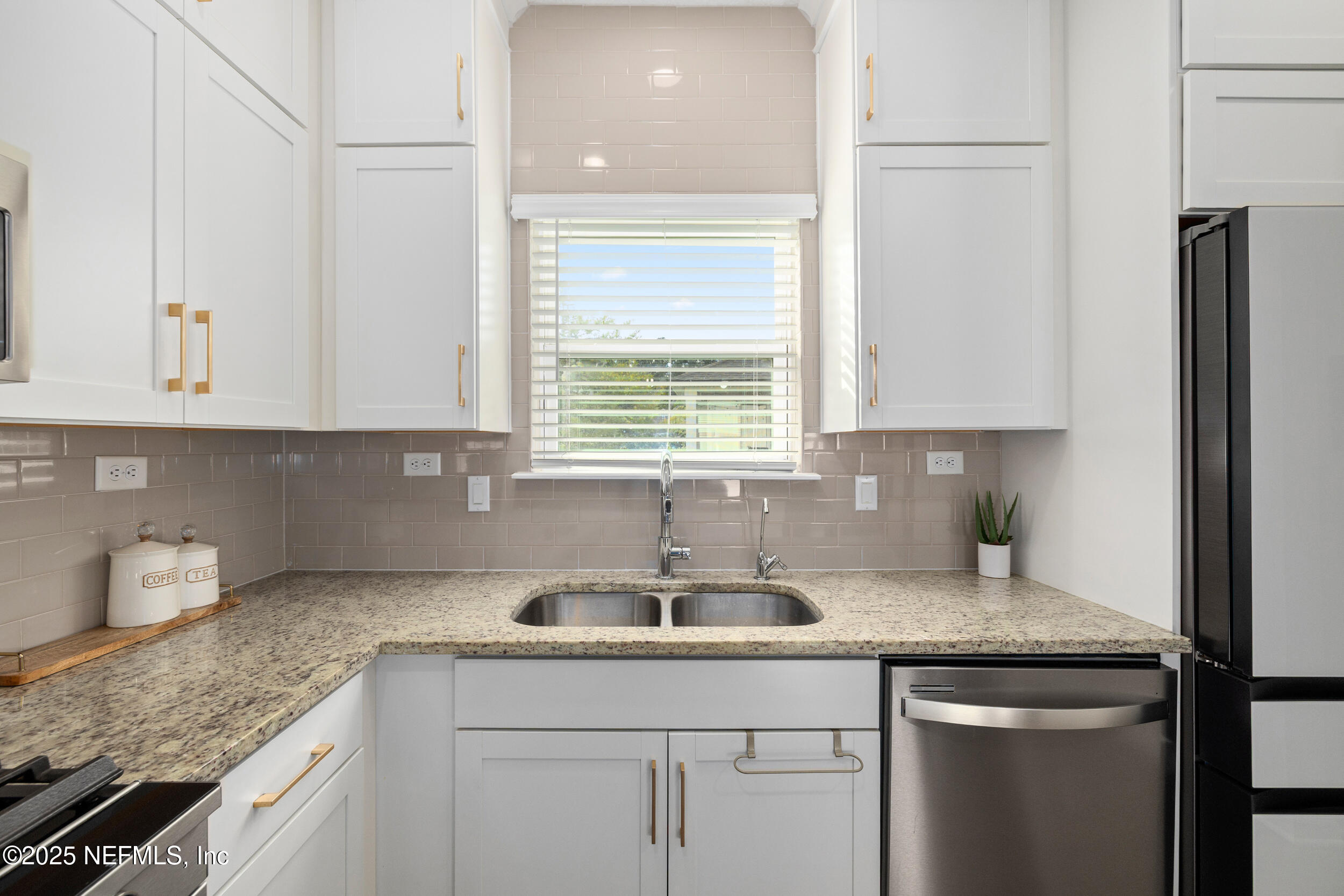 111 Beam Lane St. Augustine, FL 32095 - Photo 16 of 46 a kitchen with stainless steel appliances granite countertop a sink and a granite counter tops