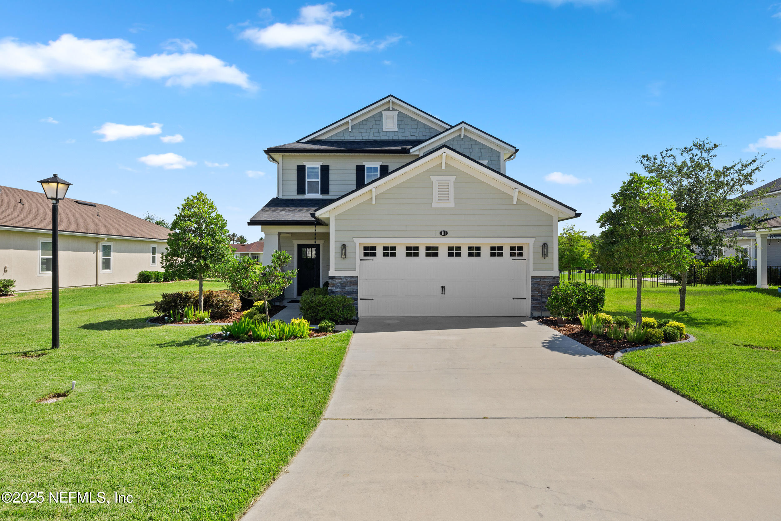 111 Beam Lane St. Augustine, FL 32095 - Photo 2 of 46 a large house with a big yard and large trees
