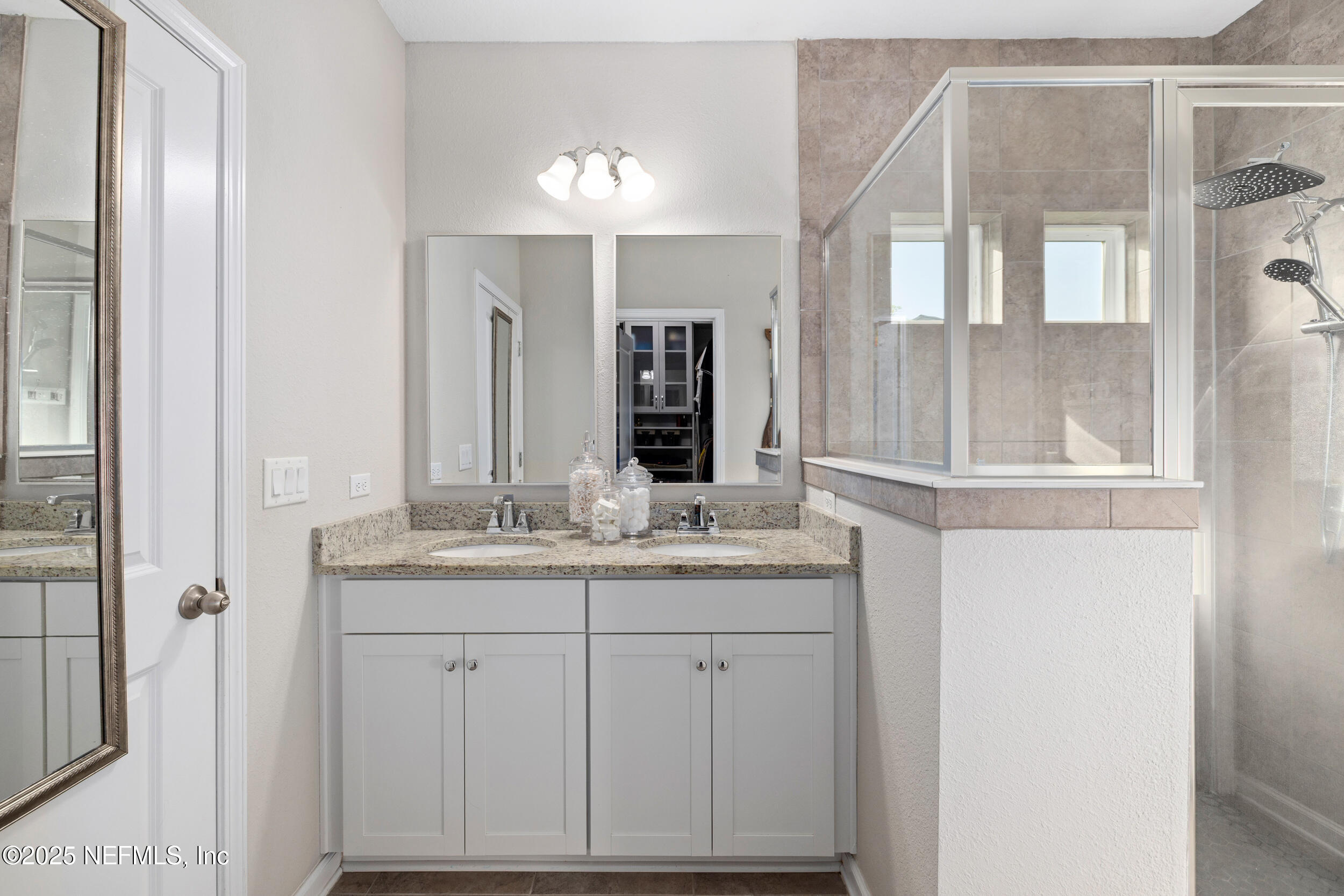 111 Beam Lane St. Augustine, FL 32095 - Photo 21 of 46 a bathroom with a granite countertop sink and a mirror