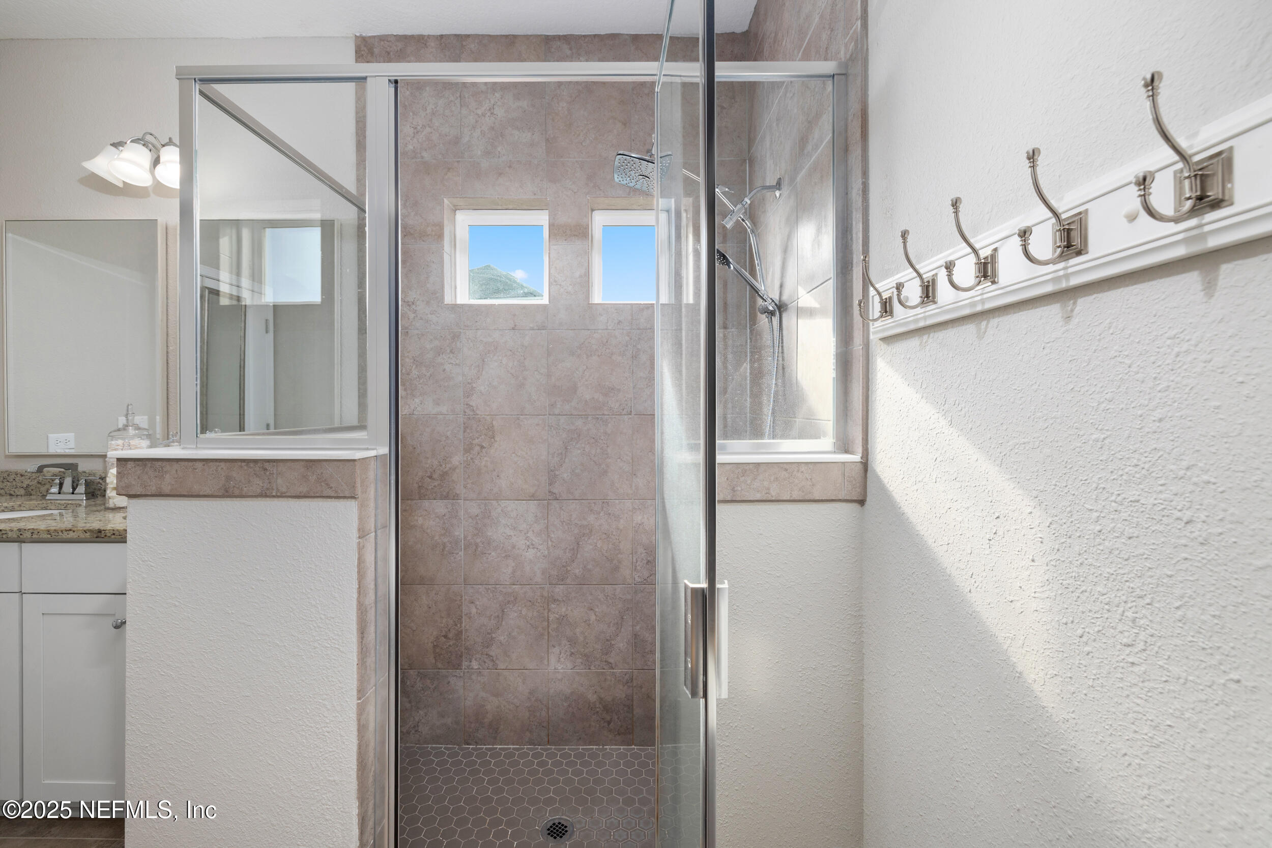 111 Beam Lane St. Augustine, FL 32095 - Photo 22 of 46 a view of a bathroom with a granite countertop shower