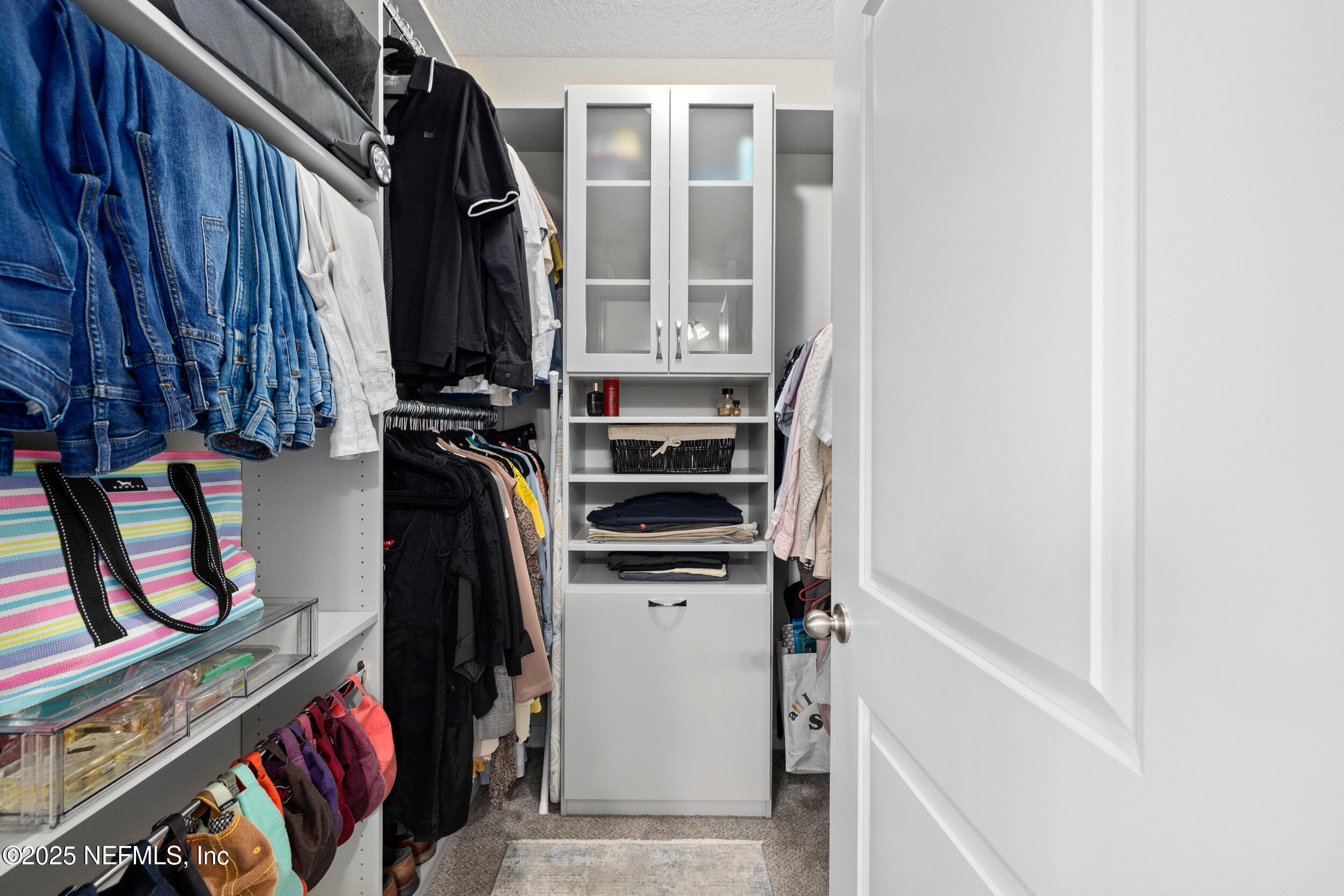 111 Beam Lane St. Augustine, FL 32095 - Photo 23 of 46 a view of walk in closet with clothes and shoes